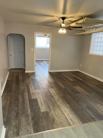 wooden floor in a hall with an entryway