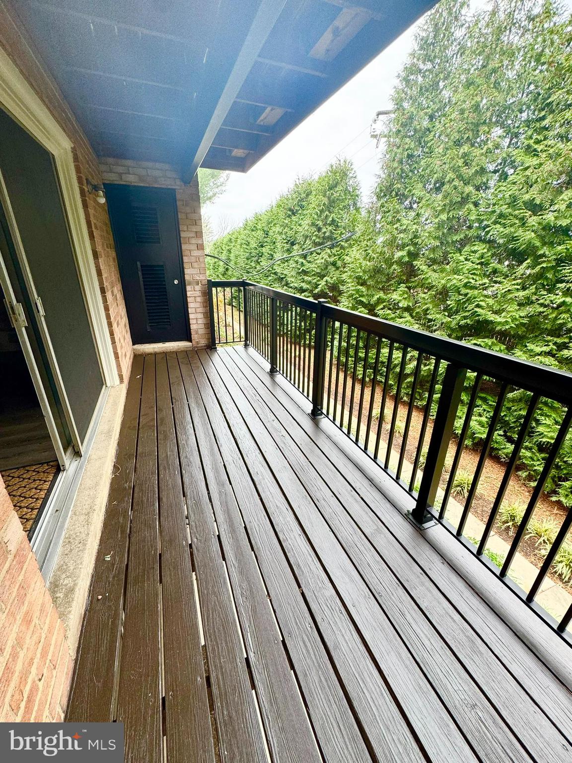 218 Locust Street Southeast, Unit 143 Vienna, VA 22180 - Photo 13 of 14 a view of balcony with wooden floor