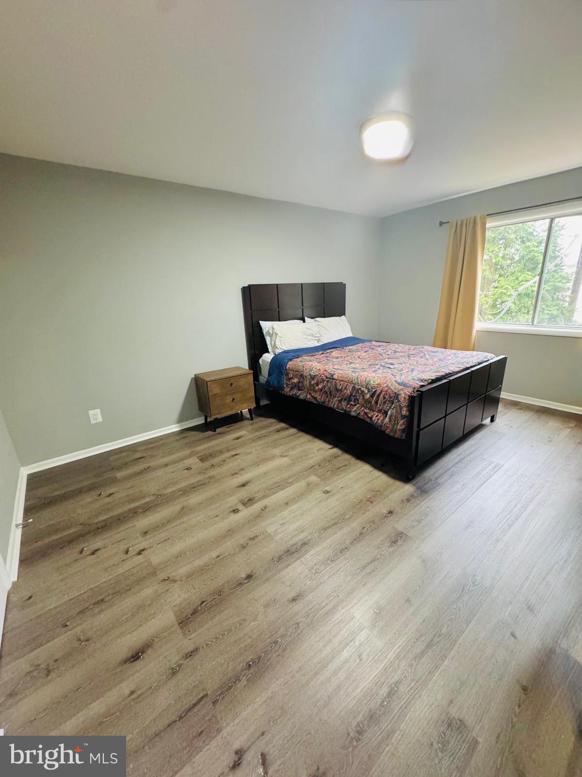 218 Locust Street Southeast, Unit 143 Vienna, VA 22180 - Photo 7 of 14 a bedroom with a bed and window