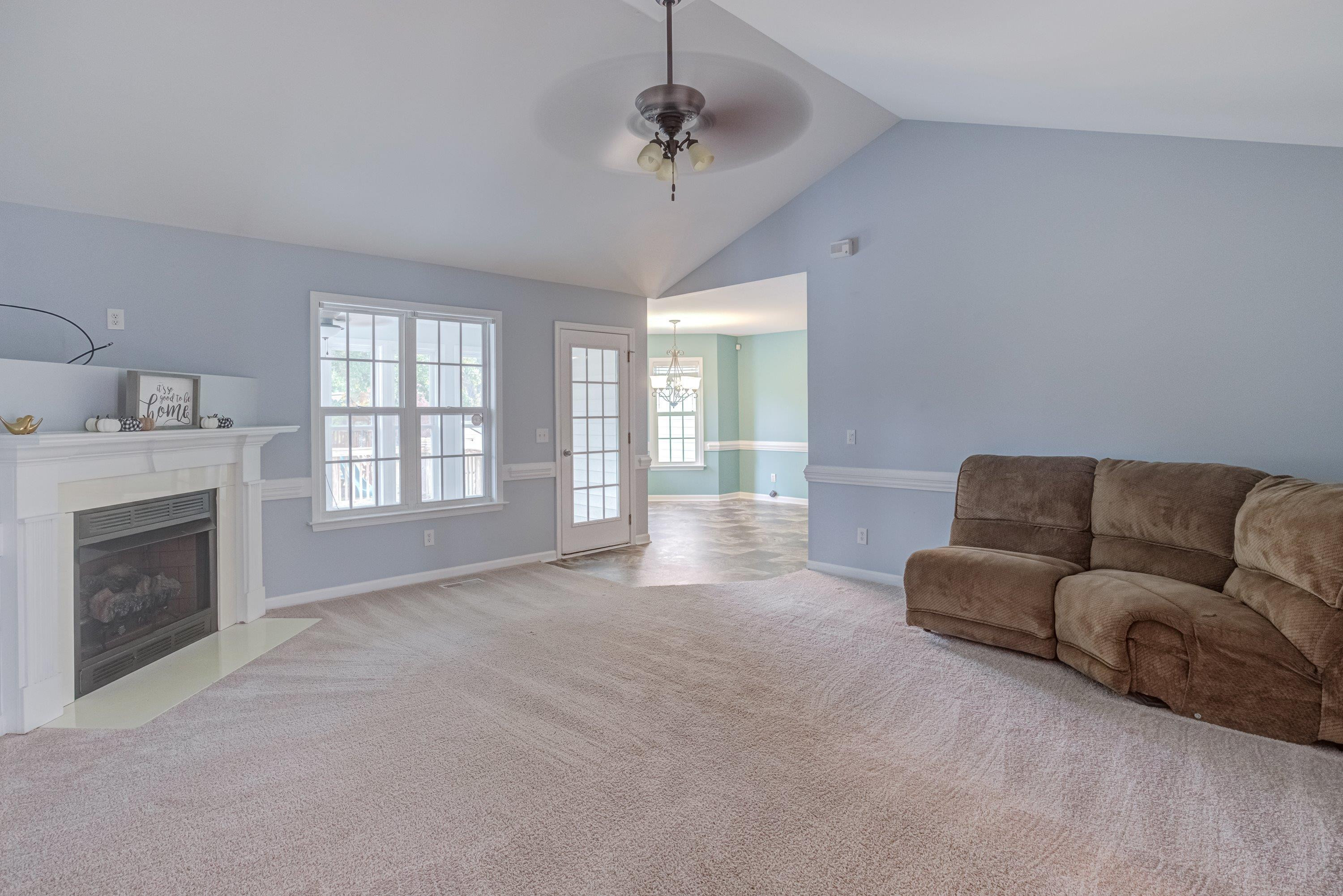 345 Axum Road Willow Spring, NC 27592 - Photo 13 of 38 Family room with corner fireplace & vaulted ceilings!