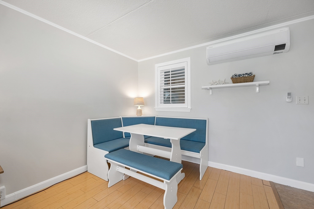 64 Esker Road, Unit 2 Hampton, NH 03842 - Photo 11 of 35 a living room with furniture and window