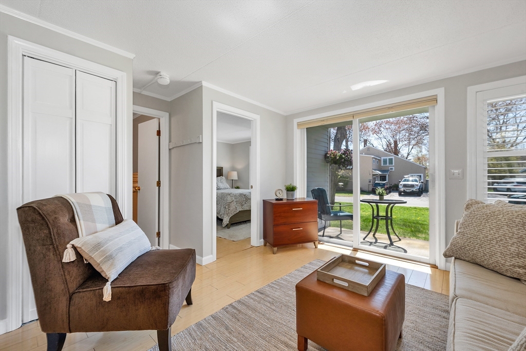 64 Esker Road, Unit 2 Hampton, NH 03842 - Photo 16 of 35 a living room with furniture and a large window
