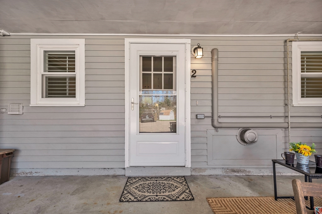 64 Esker Road, Unit 2 Hampton, NH 03842 - Photo 22 of 35 a view of a door and a window