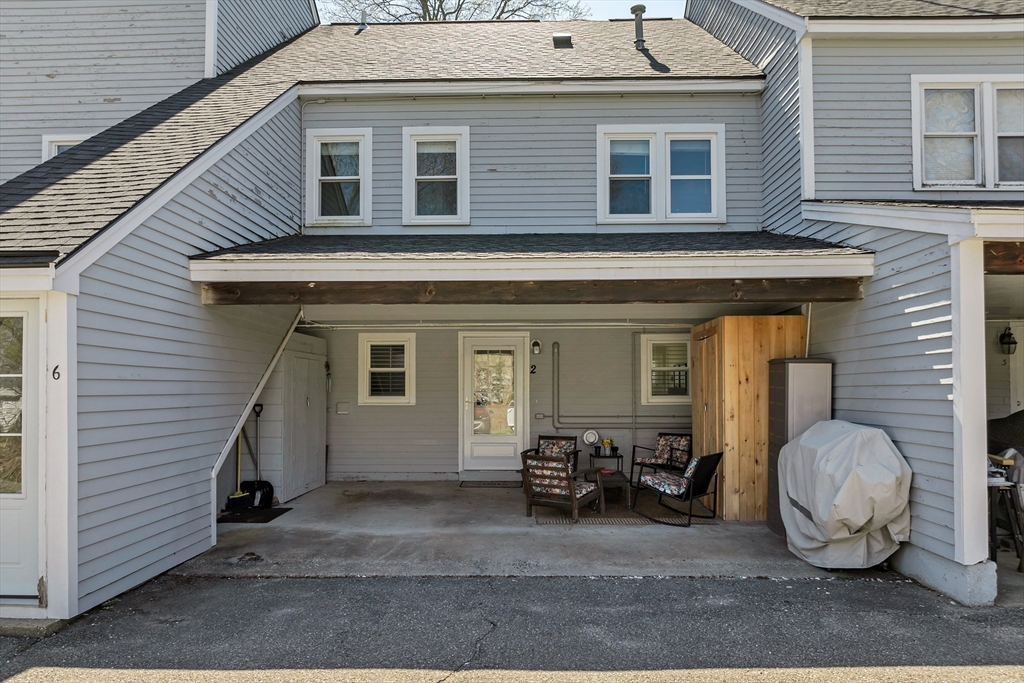 64 Esker Road, Unit 2 Hampton, NH 03842 - Photo 23 of 35 a view of a house with chair and tables