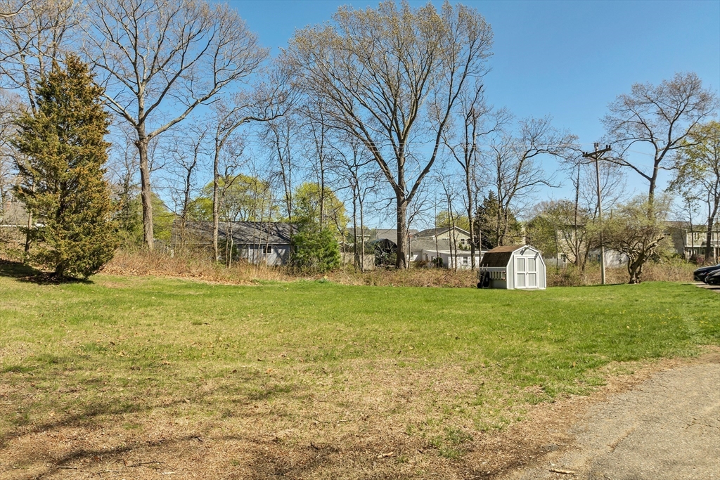 64 Esker Road, Unit 2 Hampton, NH 03842 - Photo 27 of 35 a view of back yard of the house