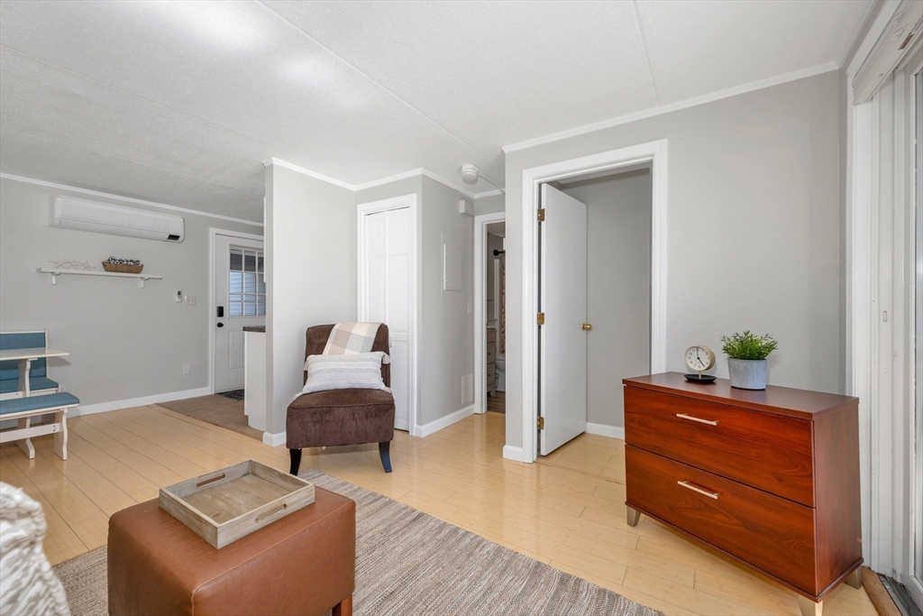 64 Esker Road, Unit 2 Hampton, NH 03842 - Photo 6 of 35 a living room with furniture and wooden floor