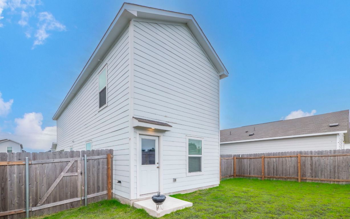 460 Marty Allen Loop Jarrell, TX 76537 - Photo 19 of 25 a view of a house with backyard and wooden fence