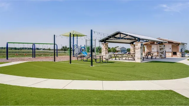 a view of swimming pool with a patio