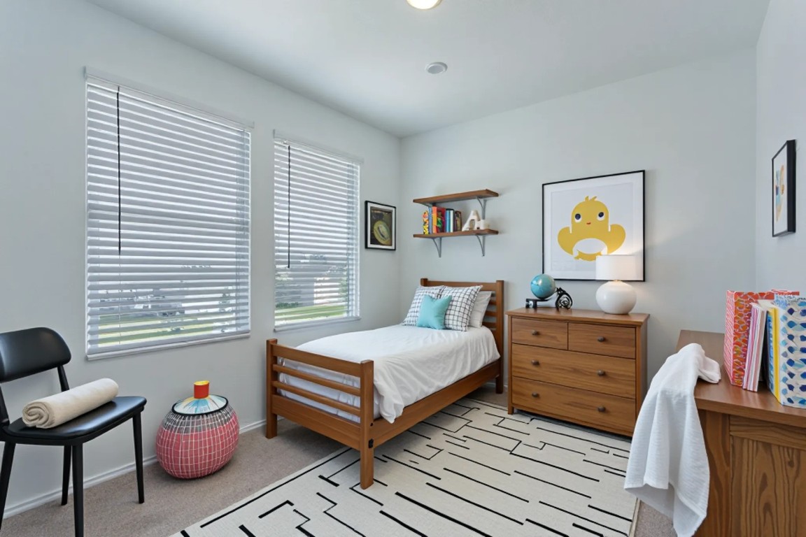 460 Marty Allen Loop Jarrell, TX 76537 - Photo 9 of 25 a bedroom with a bed and wooden floor