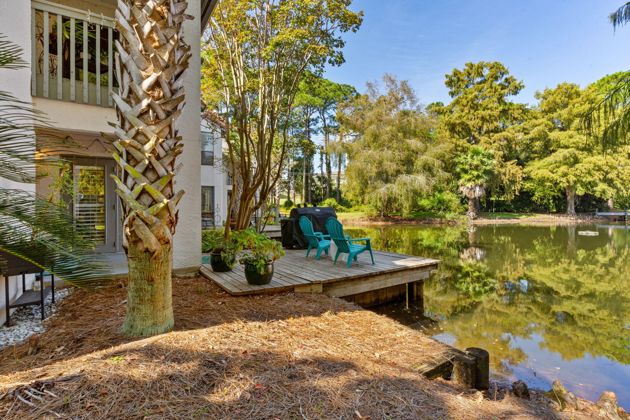 a view of a lake with a house in the background