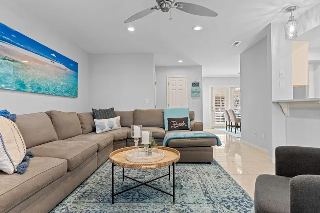 a living room with furniture and a rug