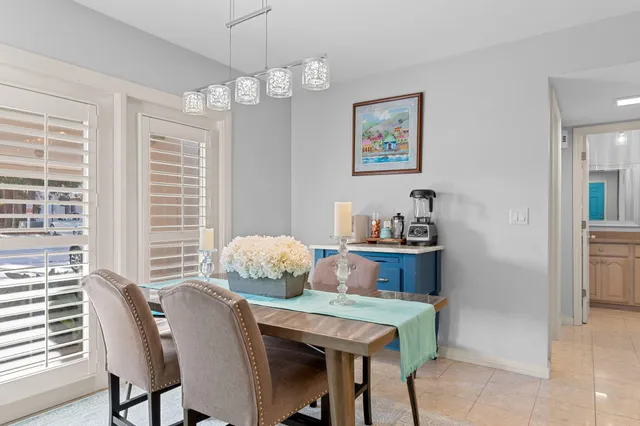 a dining room with furniture and window