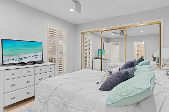 a large white bed in a white room