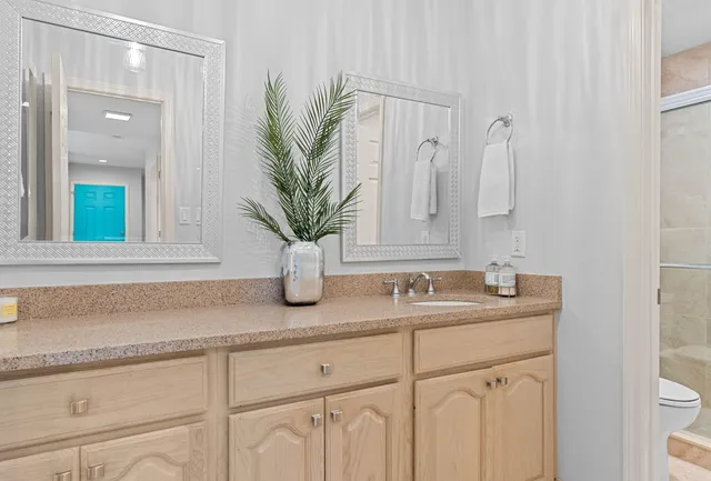 a bathroom with sink and mirror