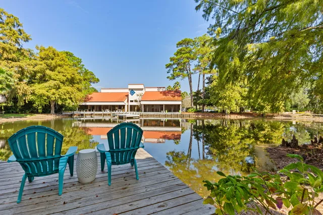 a view of balcony with wooden floor and outdoor seating