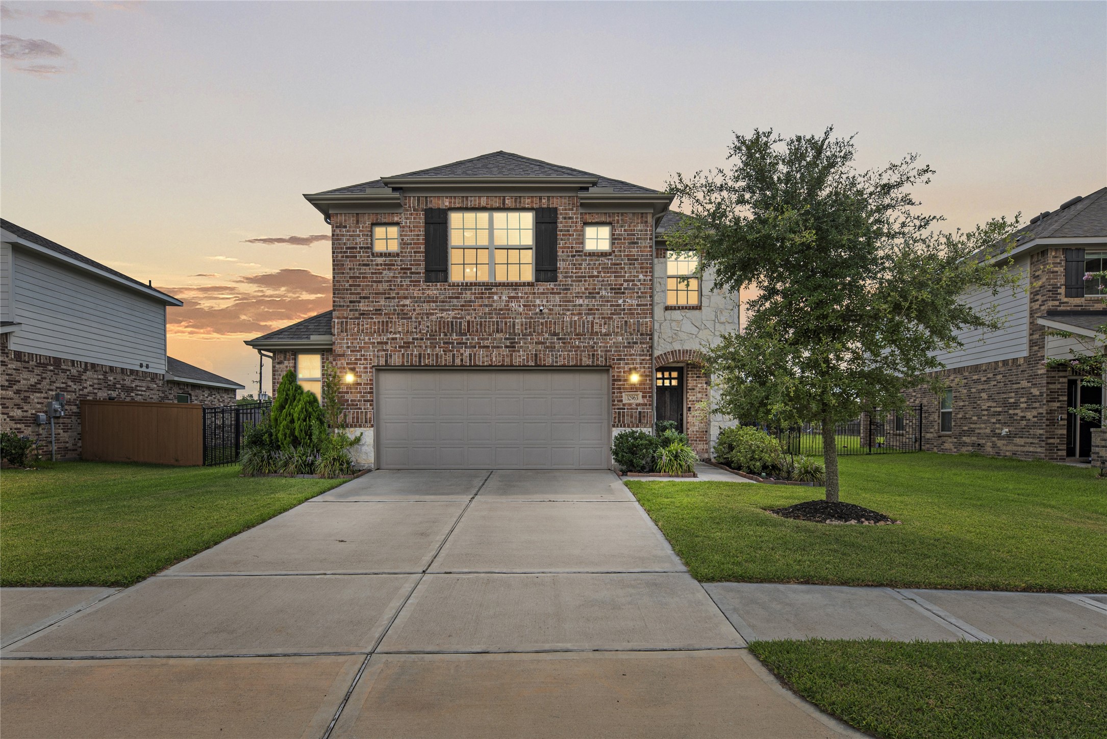 32963 Ruthie Dean Drive Fulshear, TX 77423 - Photo 1 of 45 a front view of a house with garden
