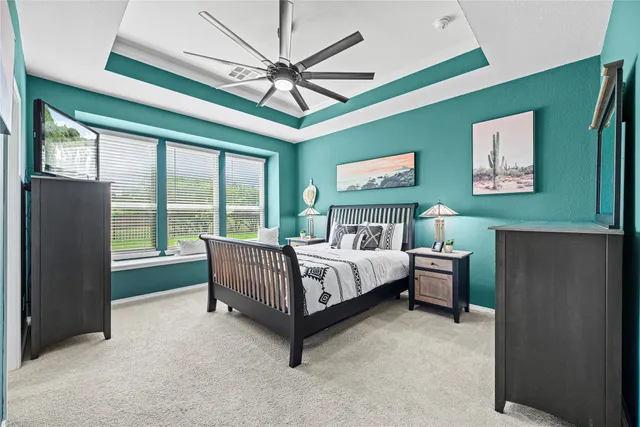 a bed room with a bed and a chandelier