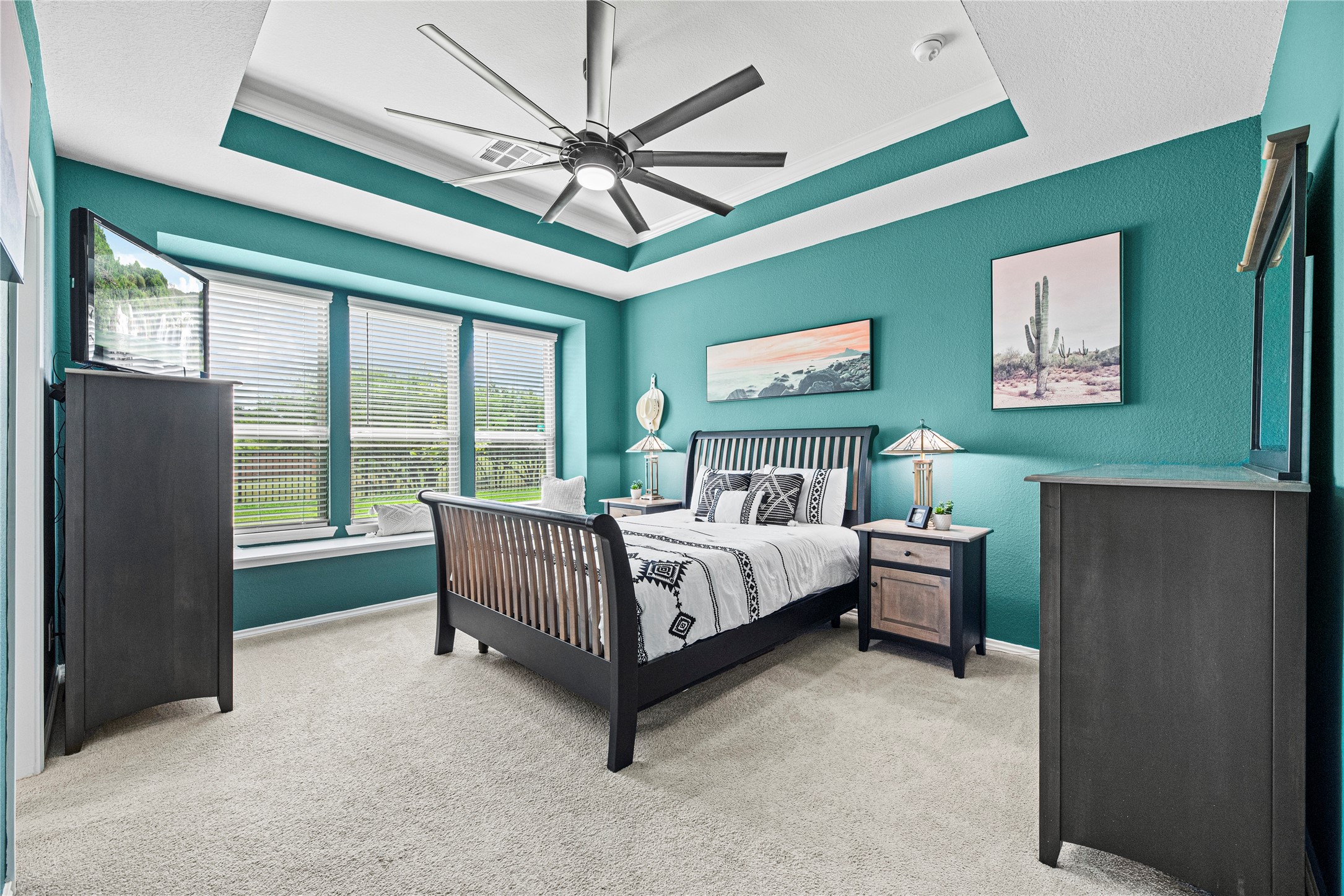 32963 Ruthie Dean Drive Fulshear, TX 77423 - Photo 12 of 45 a bed room with a bed and a chandelier