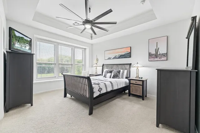 a bed room with a bed and a chandelier