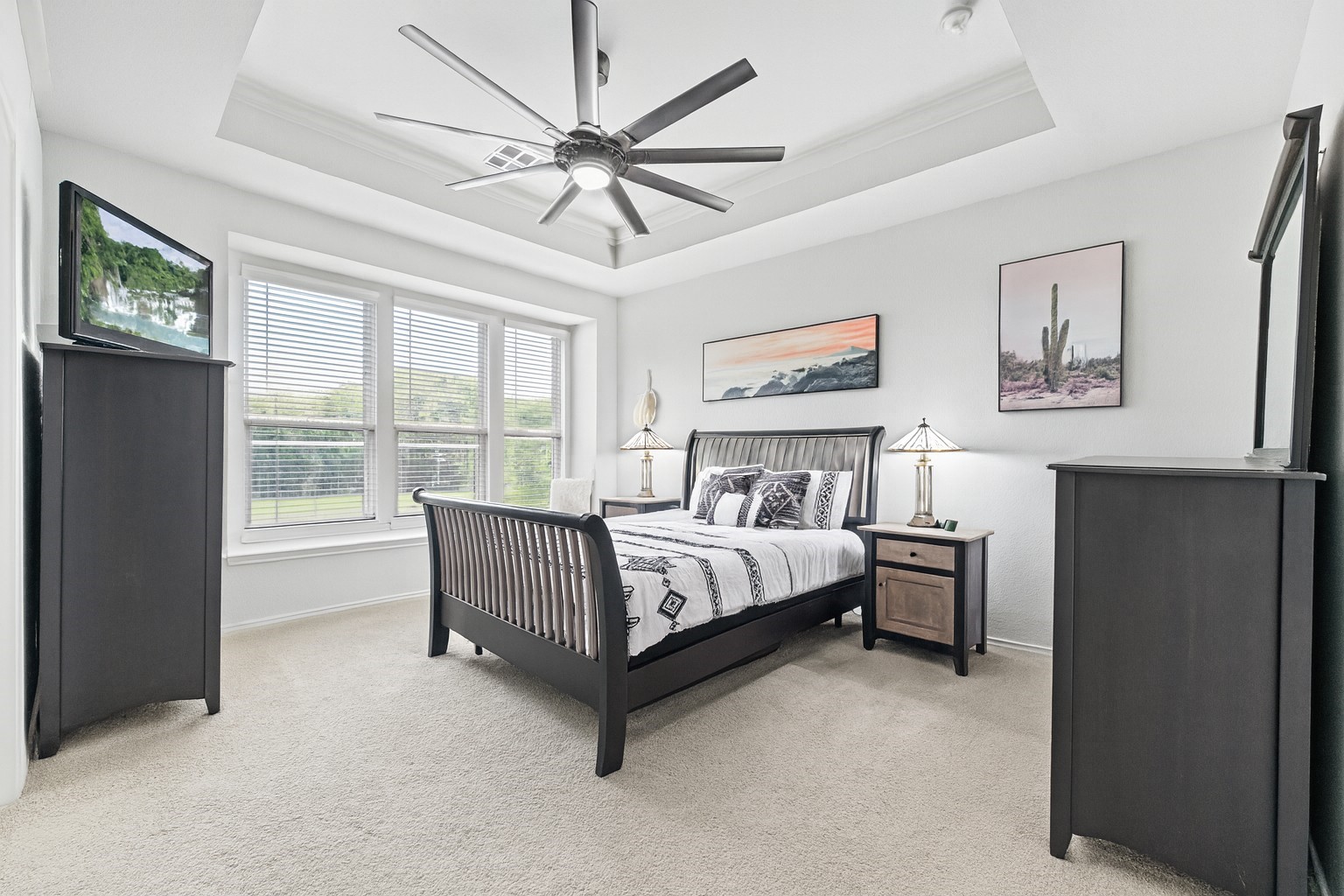 32963 Ruthie Dean Drive Fulshear, TX 77423 - Photo 13 of 45 a bed room with a bed and a chandelier