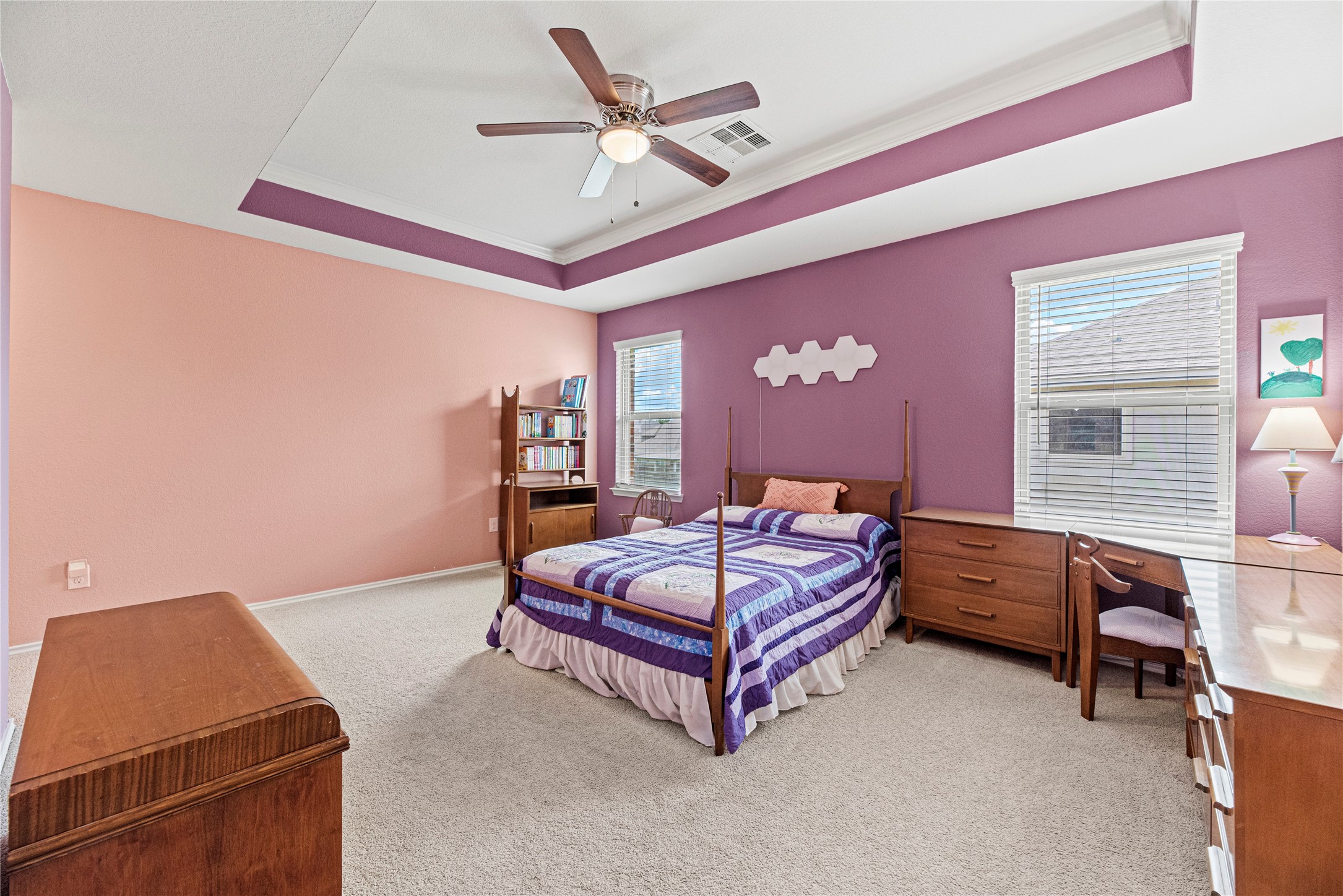 32963 Ruthie Dean Drive Fulshear, TX 77423 - Photo 22 of 45 a bedroom with a bed and a ceiling fan