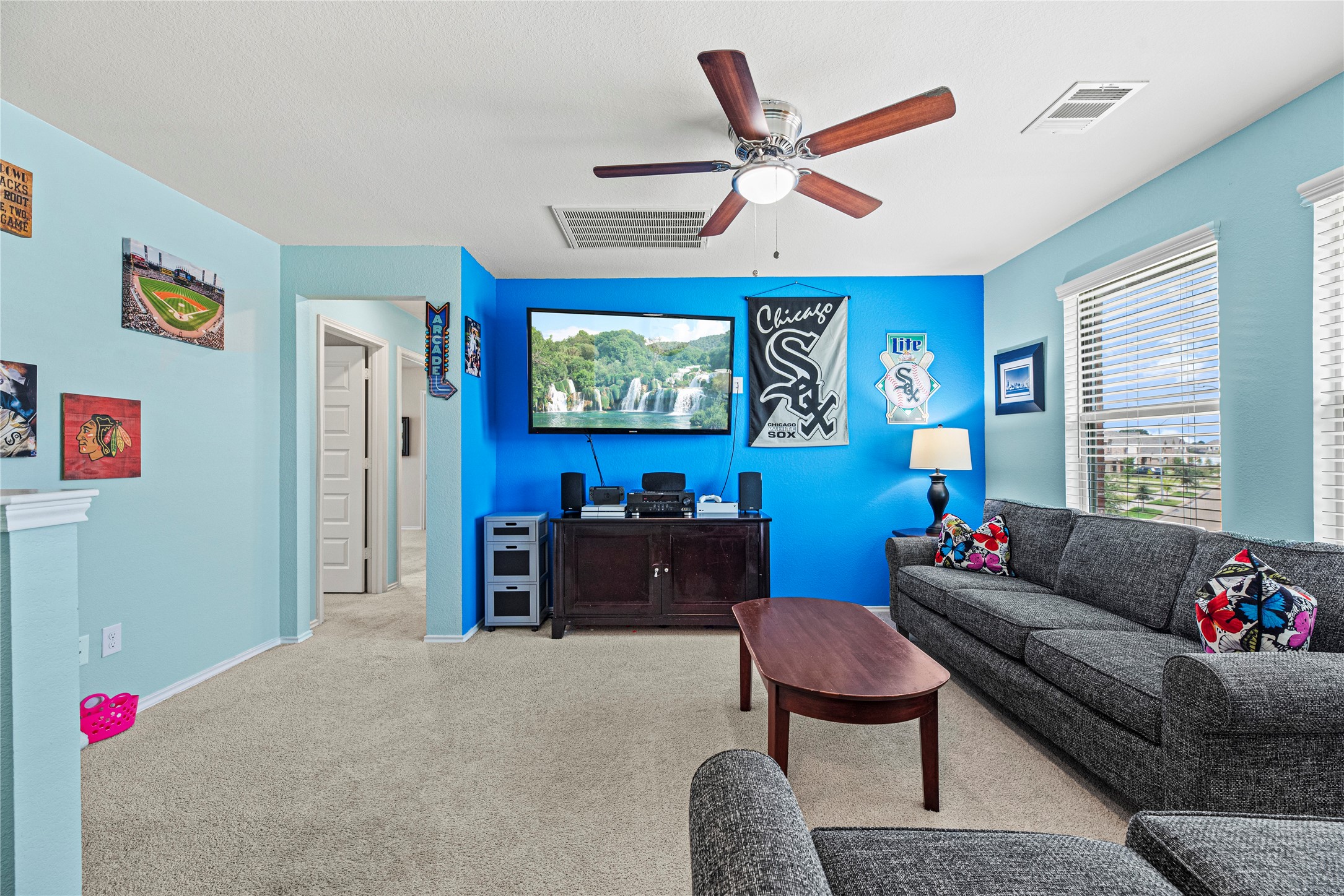 32963 Ruthie Dean Drive Fulshear, TX 77423 - Photo 26 of 45 a living room with furniture and a flat screen tv