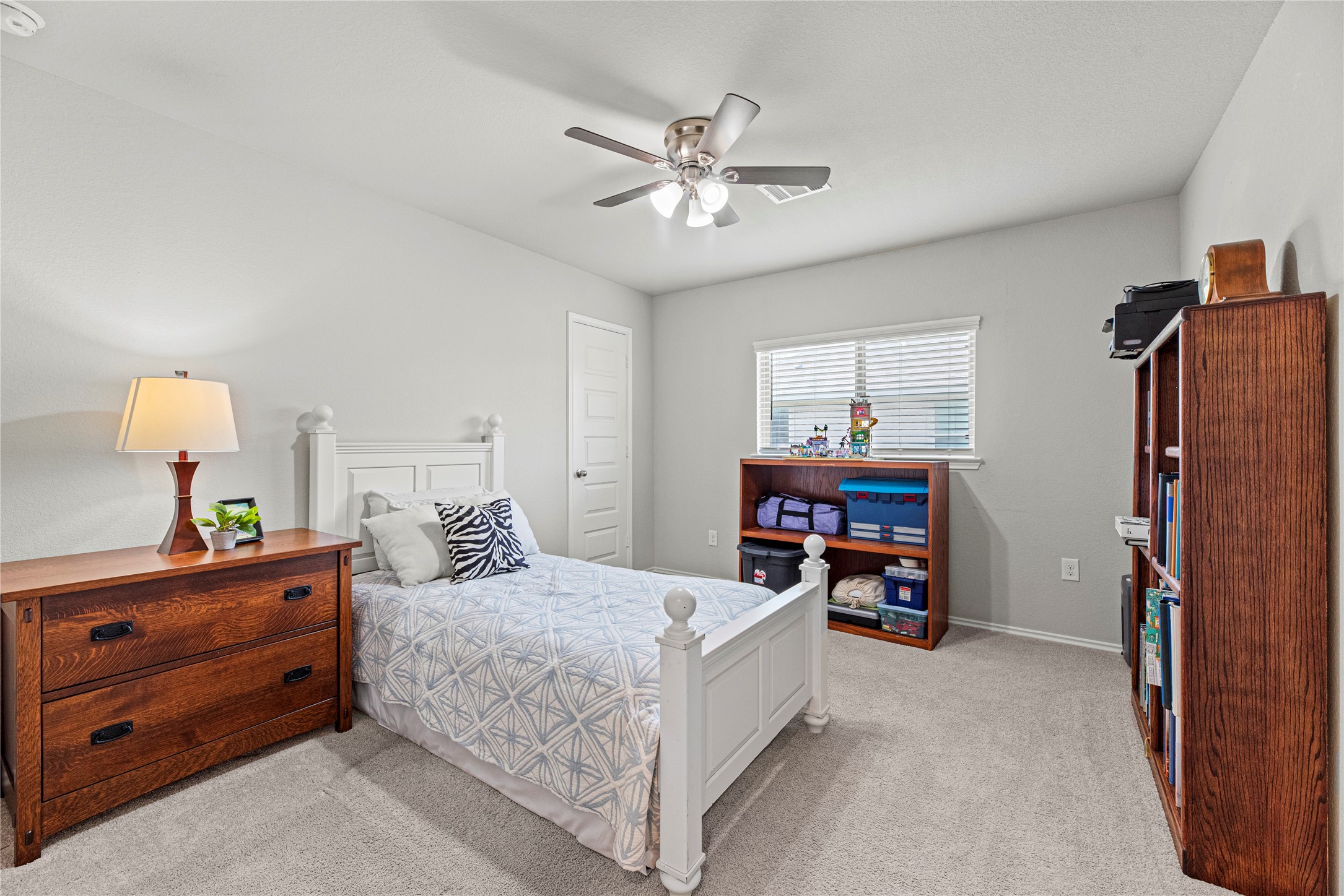 32963 Ruthie Dean Drive Fulshear, TX 77423 - Photo 28 of 45 a bedroom with a bed and furniture