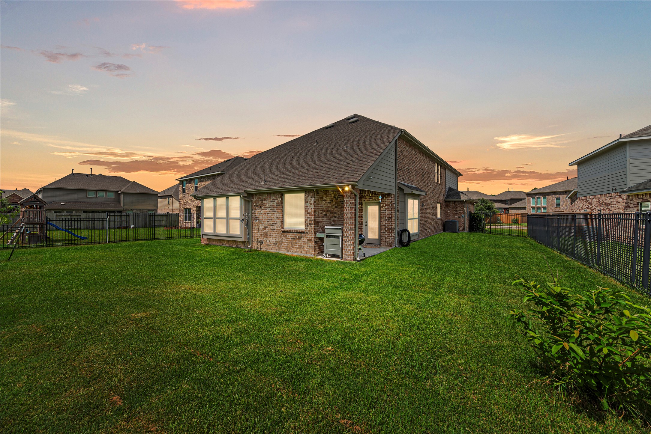 32963 Ruthie Dean Drive Fulshear, TX 77423 - Photo 33 of 45 a view of a house with backyard and garden
