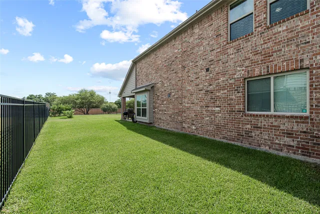 a backyard of a house with lots of green space