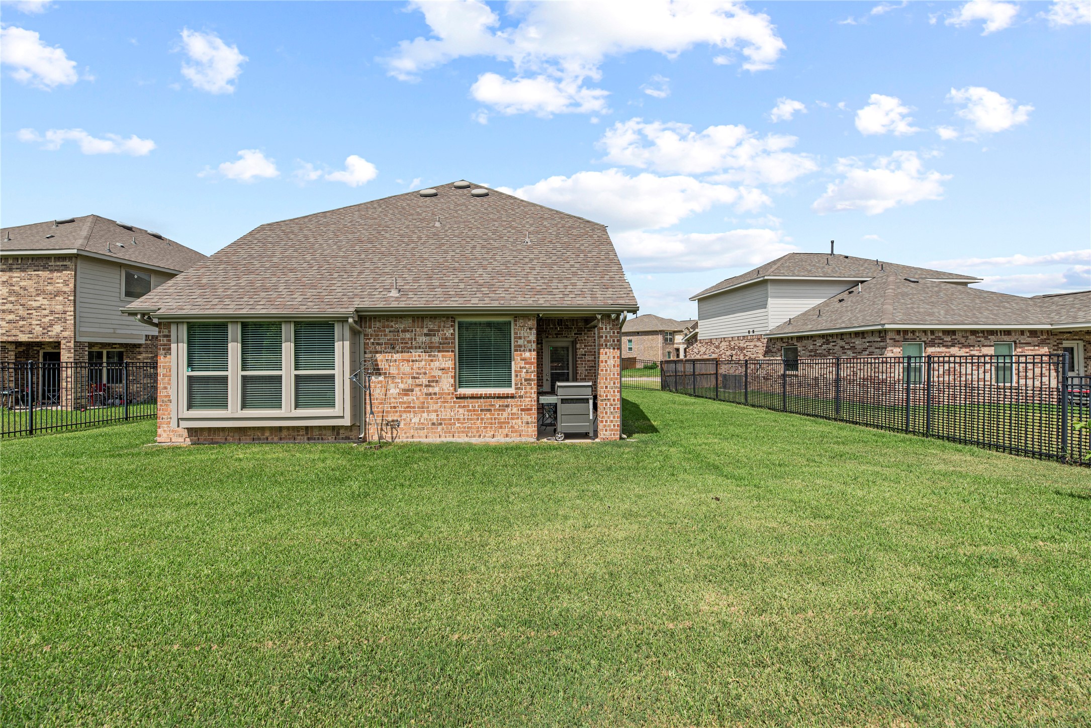 32963 Ruthie Dean Drive Fulshear, TX 77423 - Photo 39 of 45 a view of a house with a backyard