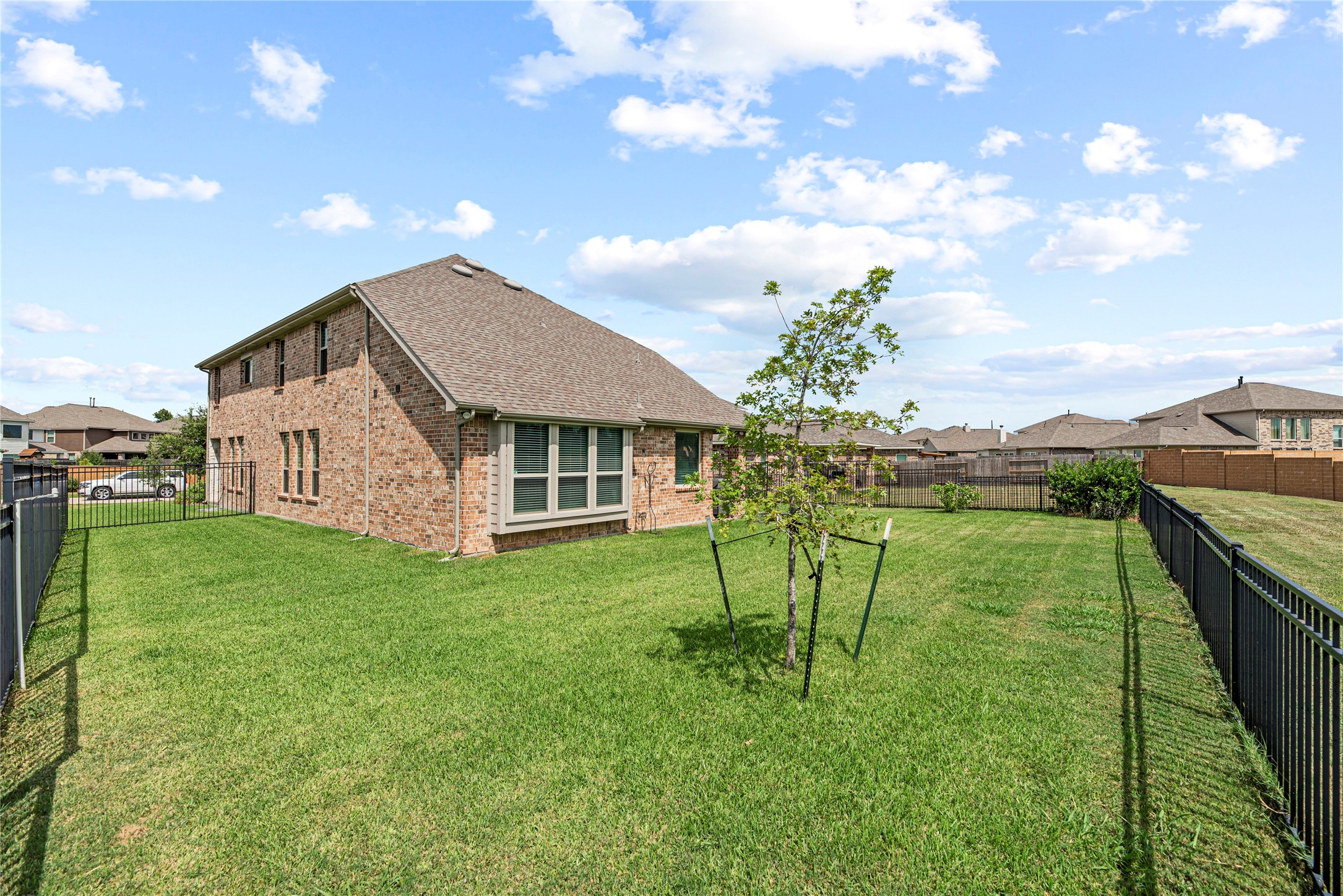 32963 Ruthie Dean Drive Fulshear, TX 77423 - Photo 40 of 45 a view of house with backyard