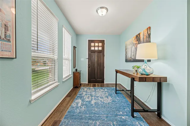 a bedroom with furniture and a window