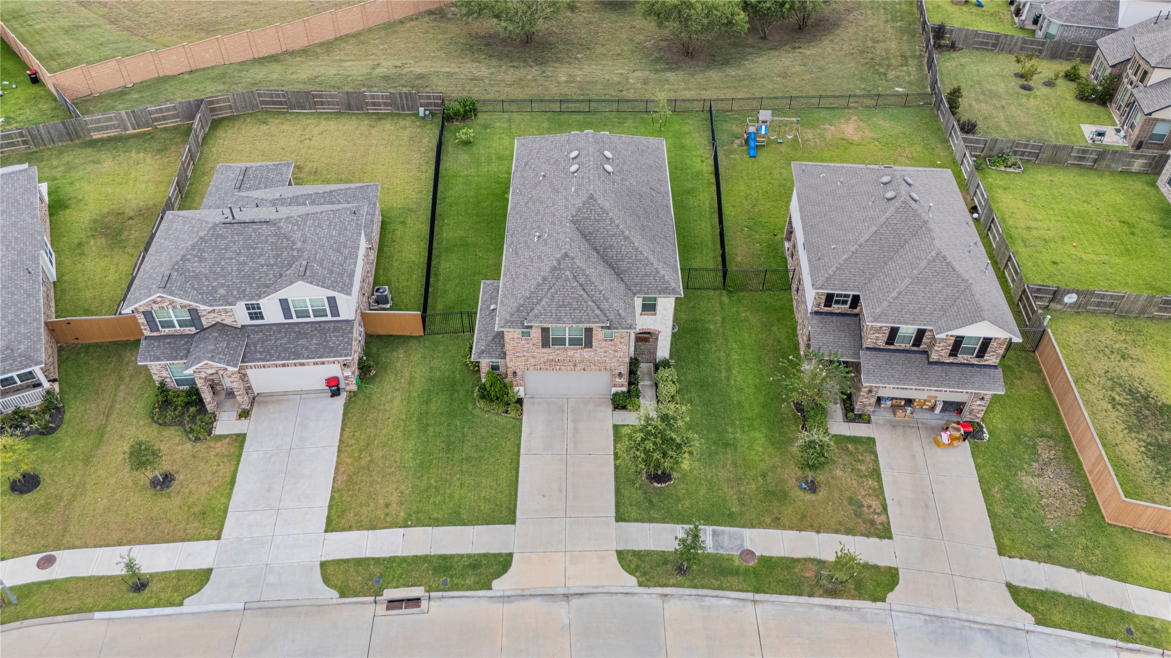 32963 Ruthie Dean Drive Fulshear, TX 77423 - Photo 43 of 45 an aerial view of houses with outdoor space