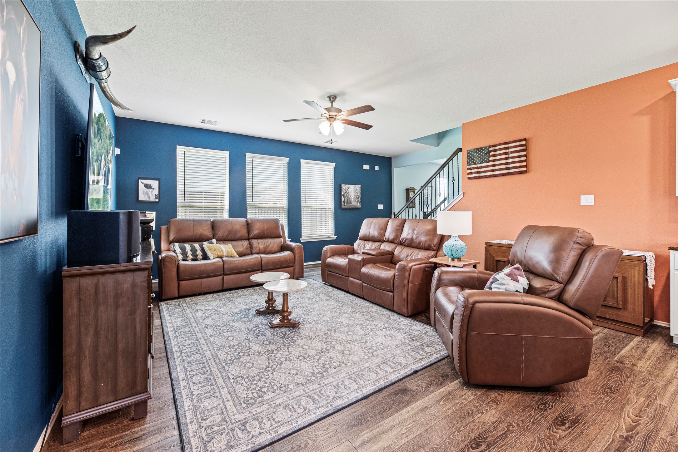 32963 Ruthie Dean Drive Fulshear, TX 77423 - Photo 7 of 45 a living room with furniture ceiling fan and a rug