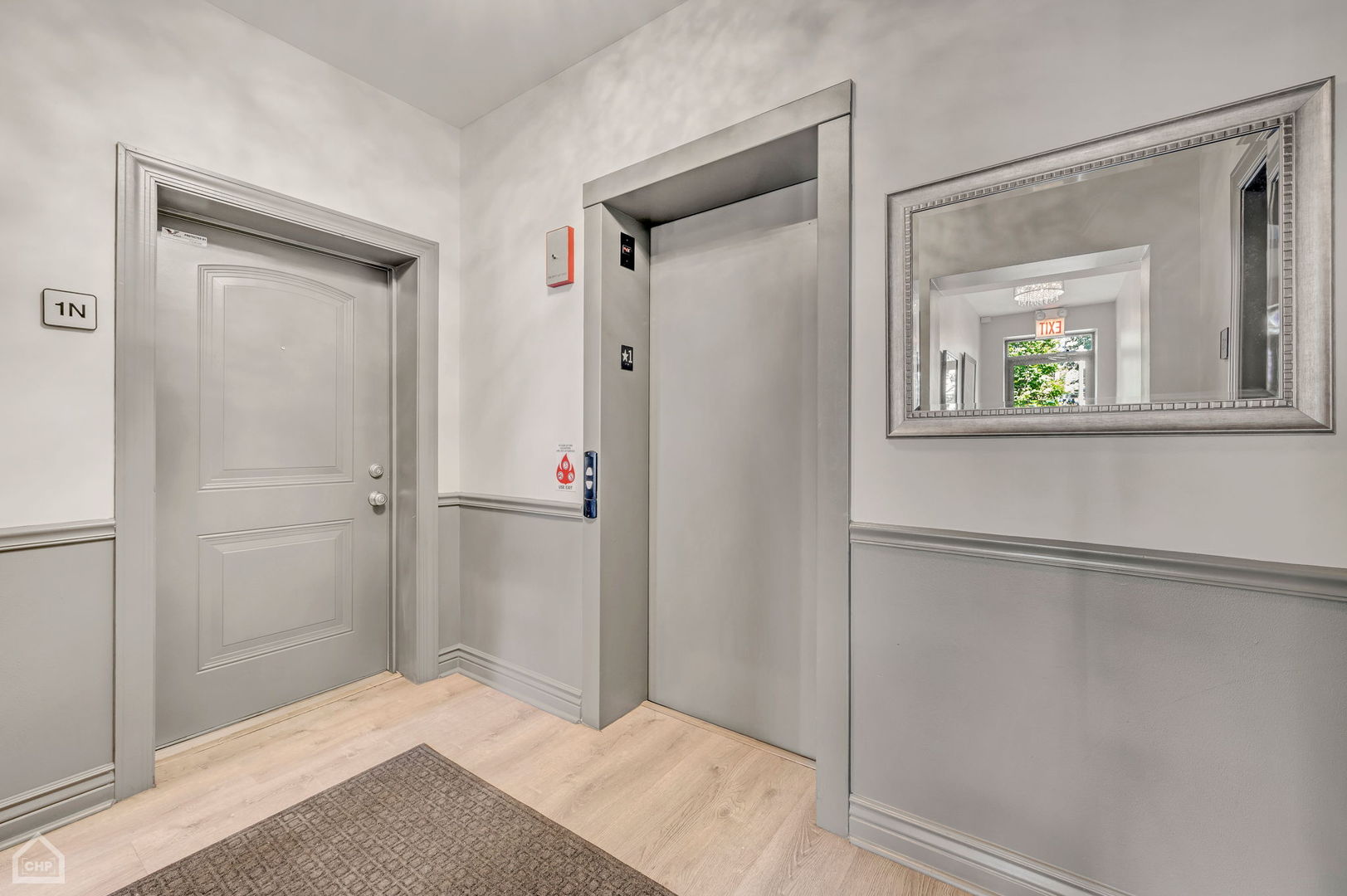 4235 South Calumet Avenue Chicago, IL 60653 - Photo 11 of 47 a bedroom with a bed and a painting on the wall