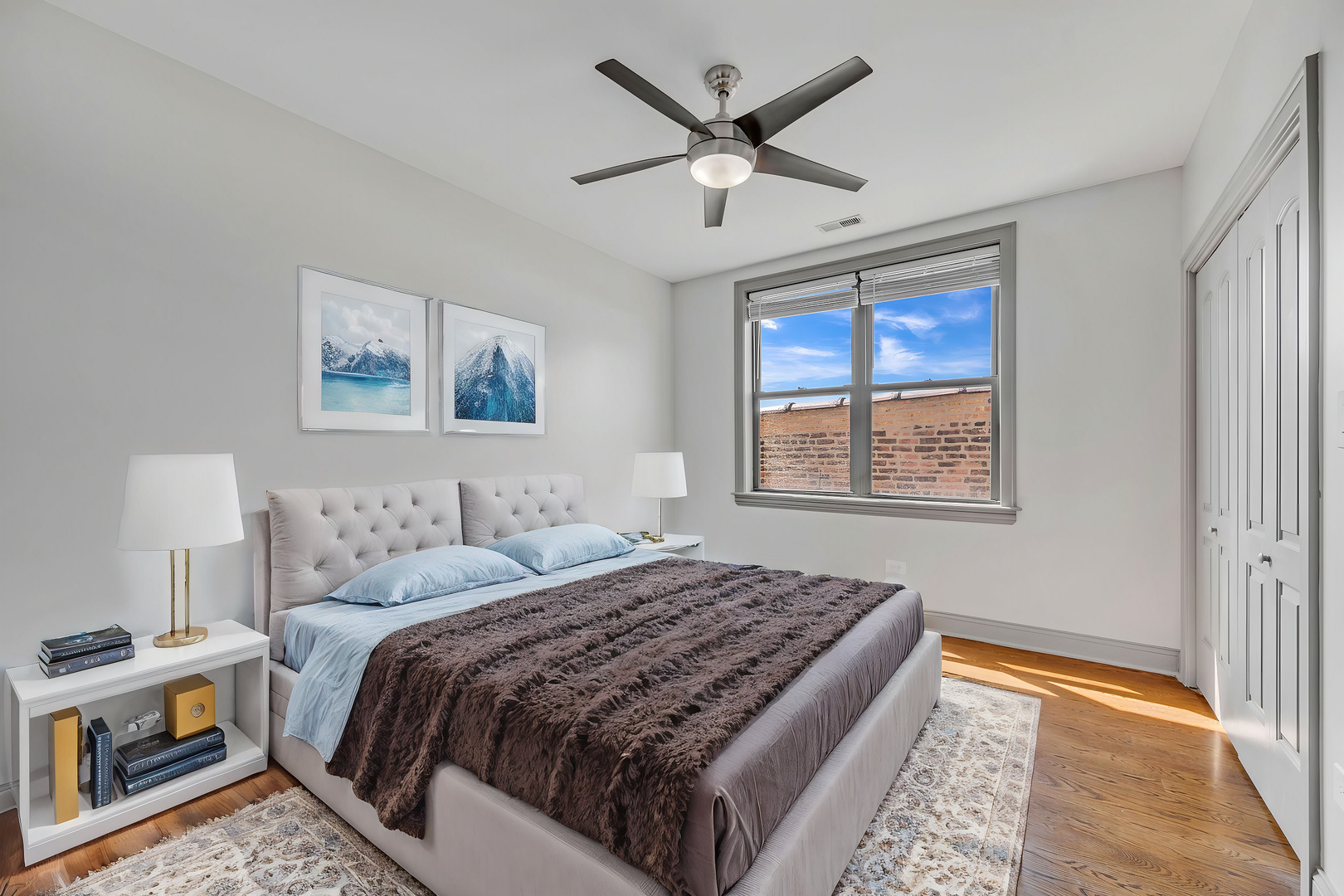 4235 South Calumet Avenue Chicago, IL 60653 - Photo 42 of 47 a bedroom with a large bed and a window