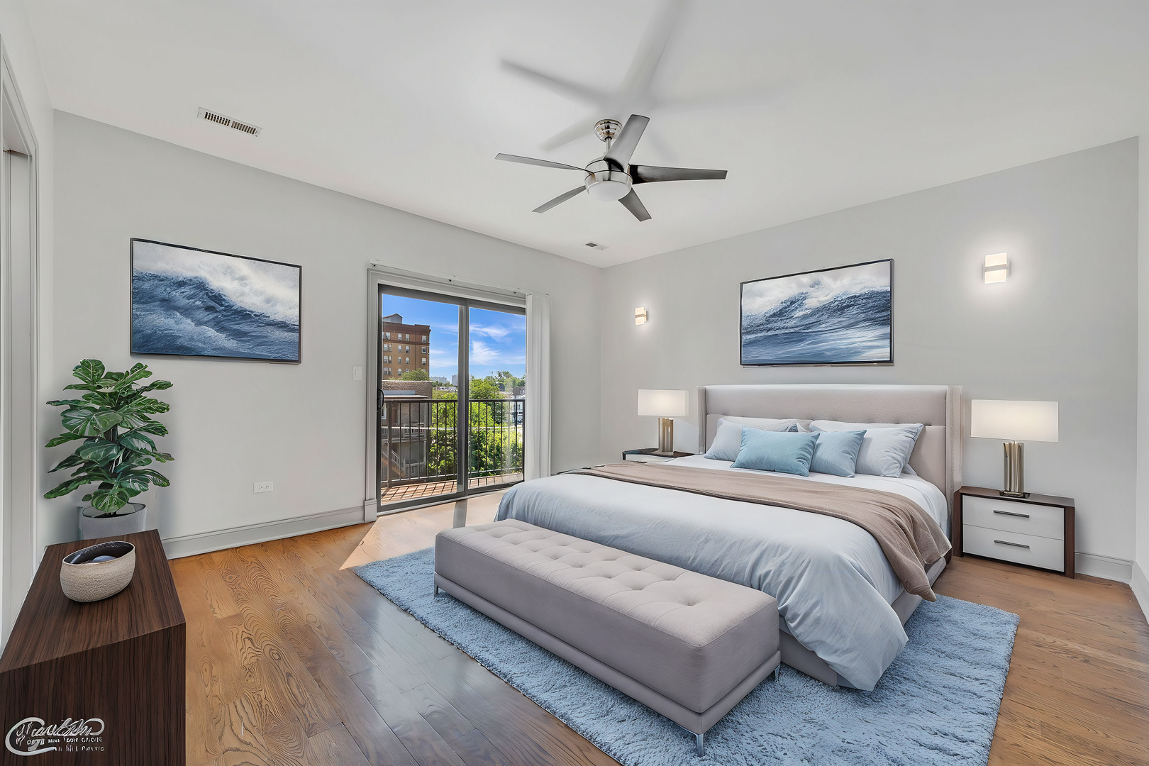 4235 South Calumet Avenue Chicago, IL 60653 - Photo 43 of 47 a spacious bedroom with a large bed and a wooden floor