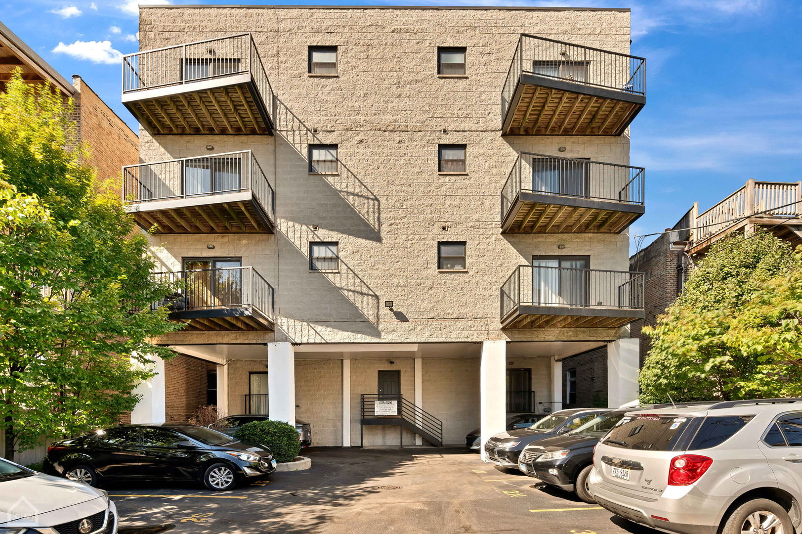 4235 South Calumet Avenue Chicago, IL 60653 - Photo 46 of 47 a front view of a building with parking space