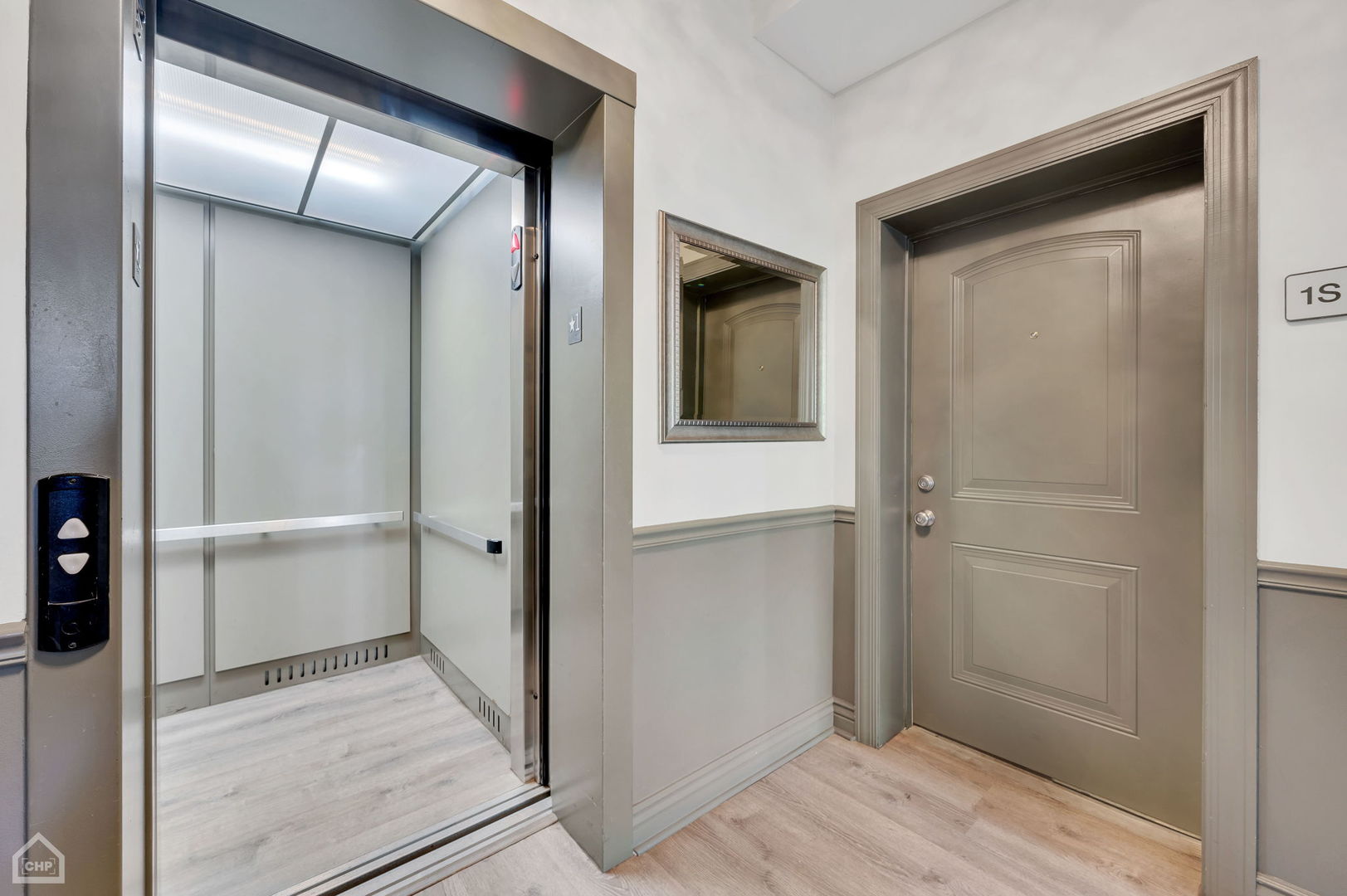4235 South Calumet Avenue Chicago, IL 60653 - Photo 9 of 47 a view of a hallway with wooden floor
