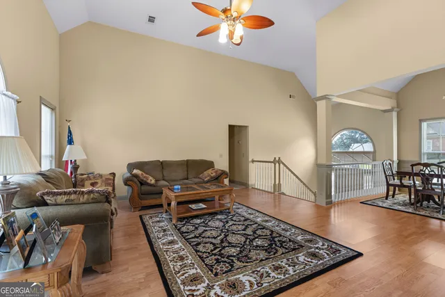 a living room with furniture and a rug