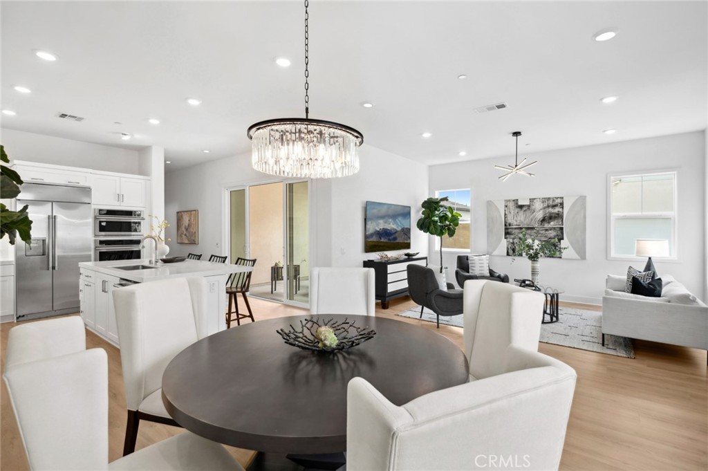 113 Bosal Irvine, CA 92618 - Photo 1 of 63 a living room with kitchen island furniture and a chandelier