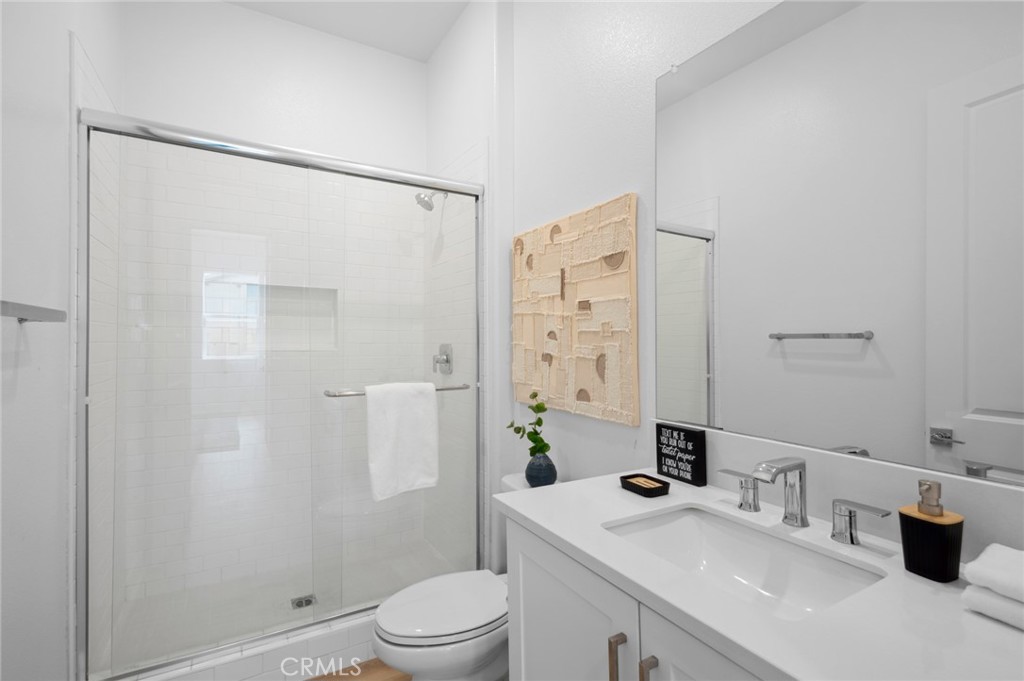 113 Bosal Irvine, CA 92618 - Photo 17 of 63 a bathroom with a sink a toilet and shower
