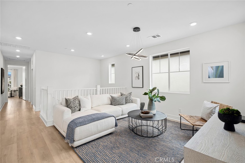 113 Bosal Irvine, CA 92618 - Photo 19 of 63 a living room with furniture and a potted plant