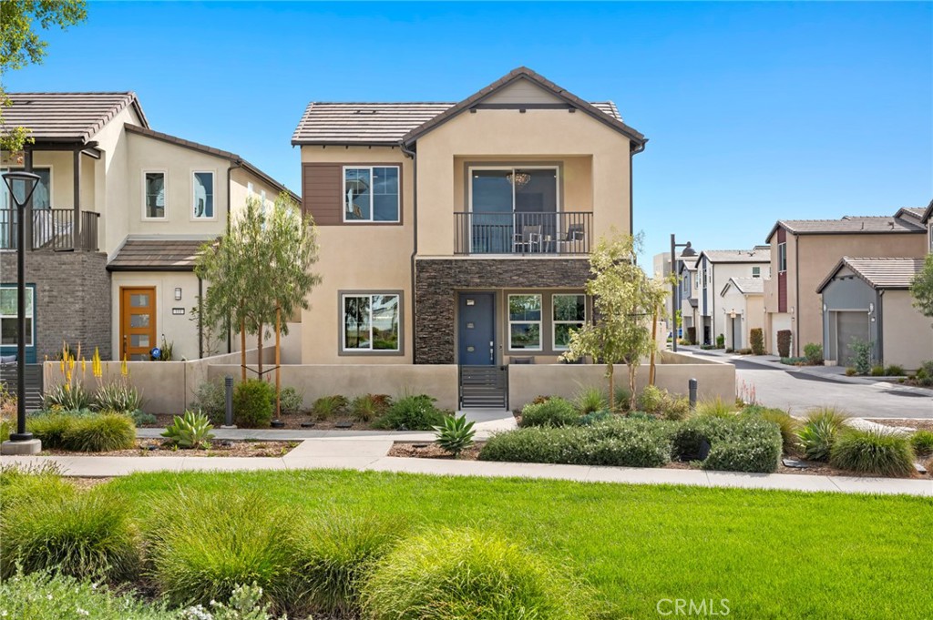 113 Bosal Irvine, CA 92618 - Photo 2 of 63 a front view of a house with a yard