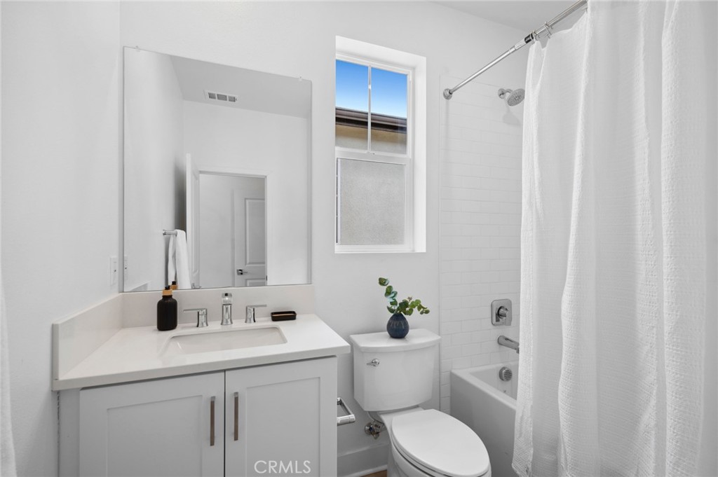 113 Bosal Irvine, CA 92618 - Photo 30 of 63 a bathroom with a sink toilet and vanity