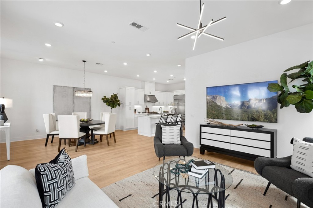 113 Bosal Irvine, CA 92618 - Photo 3 of 63 a living room with furniture and a flat screen tv