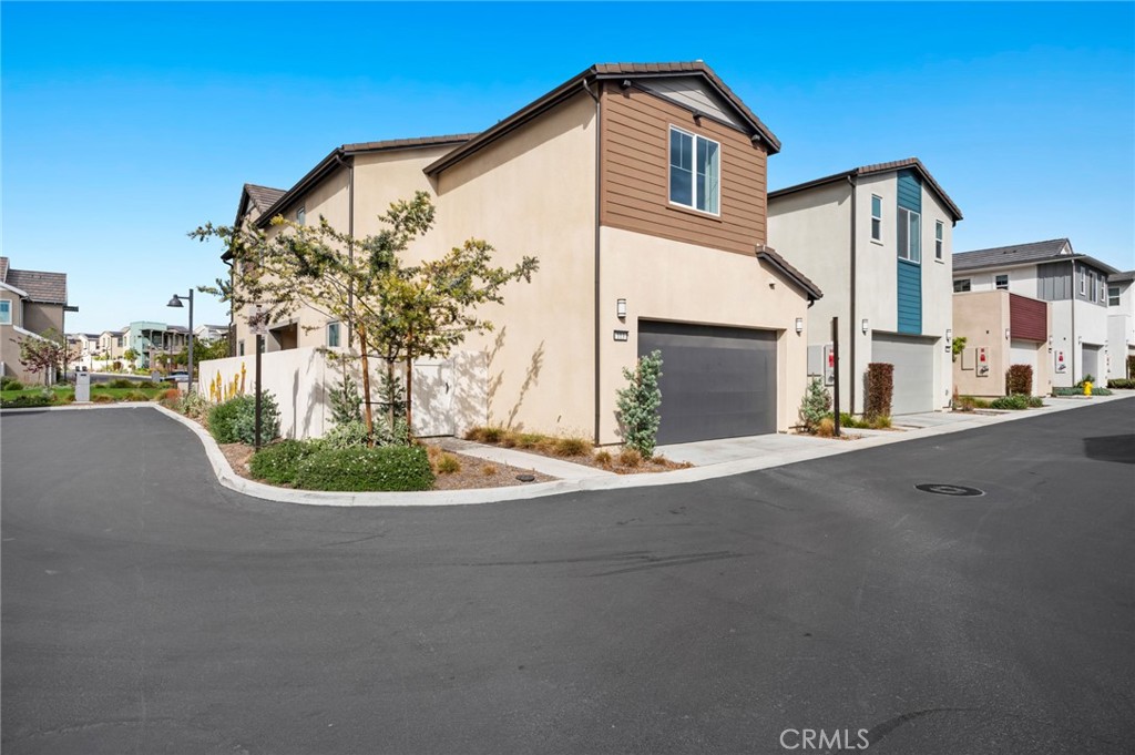 113 Bosal Irvine, CA 92618 - Photo 33 of 63 a front view of a house with a yard and garage