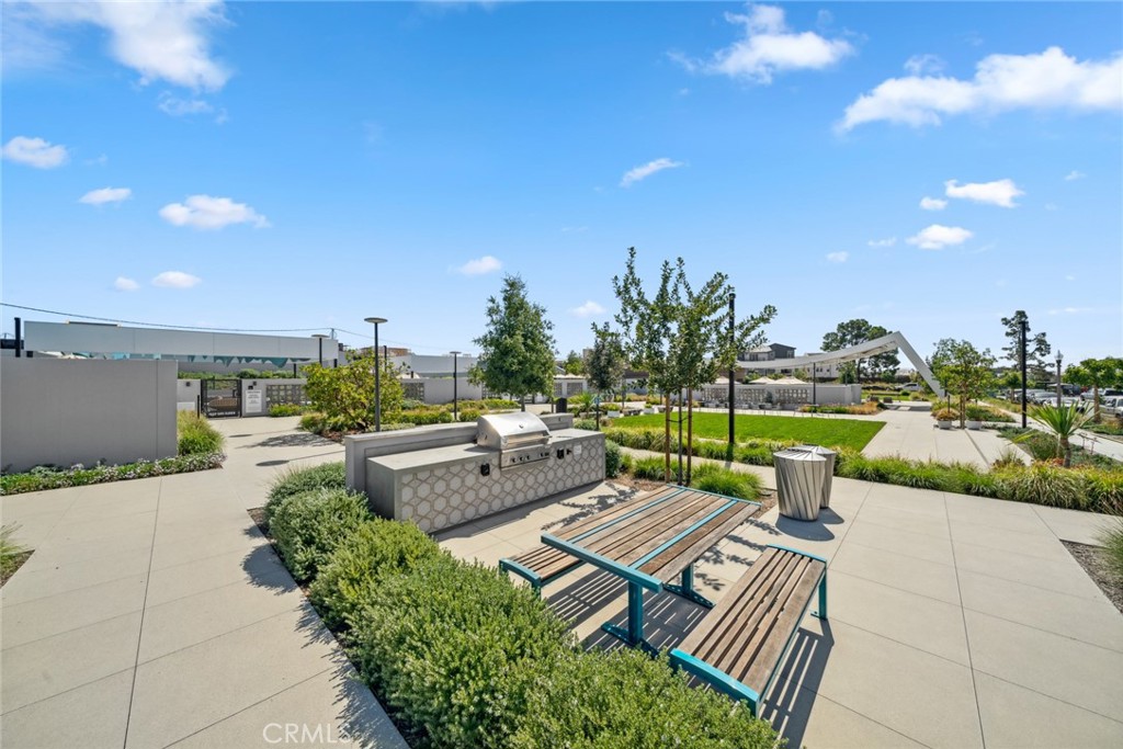 113 Bosal Irvine, CA 92618 - Photo 40 of 63 a view of a patio with couches and table and chairs with wooden fence