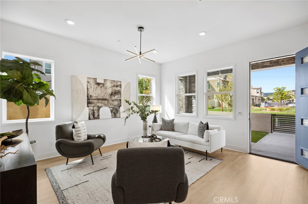 113 Bosal Irvine, CA 92618 - Photo 4 of 63 a living room with furniture potted plant and a large window