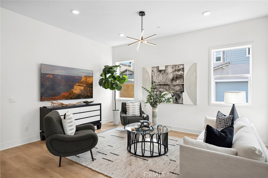 113 Bosal Irvine, CA 92618 - Photo 6 of 63 a living room with furniture and a flat screen tv